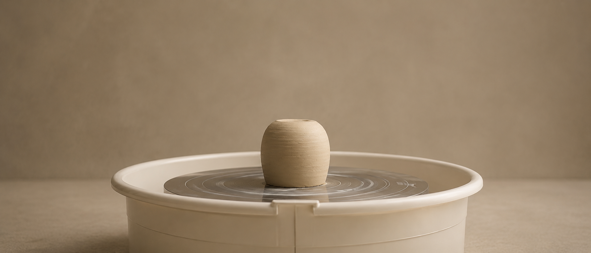 Freshly thrown ceramic vases on the pottery wheel